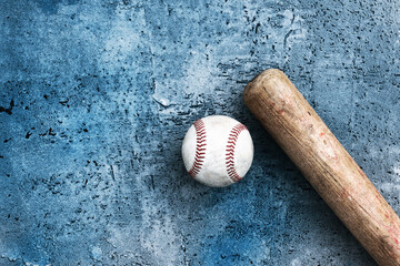 Sticker - Old grunge texture background with flat lay of wooden baseball bat and ball with copy space for sport game concept.