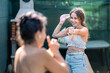 © Alvaro Lavin/Stocksy - mother and daughter playing water balloon tossing in the garden
