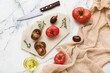 © Pixel-Shot - Board with fresh tomatoes on white background