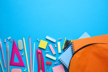 Wall Mural - Different school stationery on light blue background, flat lay with space for text. Back to school