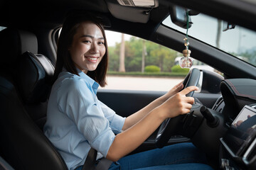 Wall Mural - Young Asian woman with car