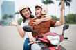 © Timeimage - Young Asian couple on the motorbike