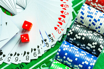 Gambling dice and poker cards in casino and casino chips poker table game business gambling concept