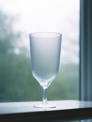 Canvas Print - Closeup of beautiful glassware on a windowsill at home