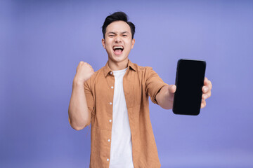 Wall Mural - Photo of young Asian man on background