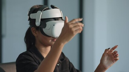 Close up businesswomen executive using virtual reality headset in office. Woman testing VR goggles or glasses for working virtual project .VR technology and business concept