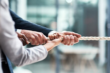 Hands, Teamwork And Rope With Business People Grabbing During A Game Of Tug Of War In The Office. Collaboration, Help Or Strength With A Team Of Employees Or Colleagues Pulling An Opportunity At Work