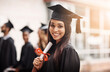© N Hiraman/peopleimages.com - Woman, graduation and portrait of a college student with a diploma and smile outdoor. Female person excited to celebrate university achievement, education success and future at school graduate event