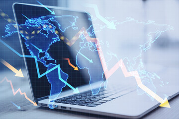 Poster - Close up of laptop computer on office desk with downward falling arrows and map on blurry background. Stock or financial market crash, crisis concept. Double exposure.