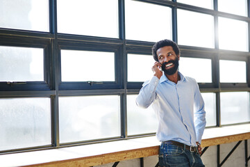 Wall Mural - Window, phone call and thinking with a business man in the office for communication or networking. Happy, vision and idea with a happy male employee chatting in the workplace during his break