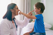 © AS/peopleimages.com - Woman doctor, playing and child at a hospital for healthcare and medical consultation. Fun, nose poke and pediatrician working with a laugh and happiness in a clinic with boy patient with exam