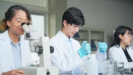 Poster - Multinational researcher group experimenting in the lab.