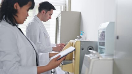 Poster - Group of multinational scientists working in laboratory.