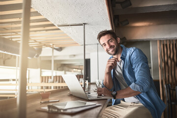 Poster - Man in cafe, portrait with laptop and small business, entrepreneur in hospitality industry and connectivity. Happy male owner, coffee shop franchise and wireless connection with digital admin on pc