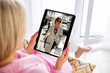 © Kaspars Grinvalds - Woman reading magazine on tablet computer
