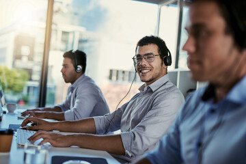 Poster - Customer service, smile and coworking, portrait of happy man consulting with advice, computer and team at help desk. Phone call, conversation and happiness, callcenter consultant in modern office.