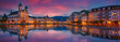 Scenic evening panorama view of the Old Town medieval architecture in Lucerne, Switzerland. Dramatic scene with Reuss river and Jesuit church. Wonderful vivid cityscape during sunset with colorful sky