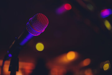 Wall Mural - Close up of microphone in concert hall or conference room.