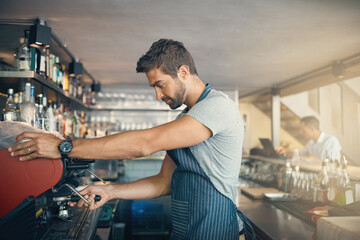 Poster - Man in cafe, coffee machine and barista, prepare caffeine drink order with process and production in hospitality industry. Service, male waiter working on espresso or latter beverage in restaurant