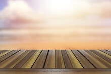 Mock Up View Of Brown Old Teak Wooden Table Top With Ocean Beach  Blurred Background.