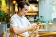 © 1112000 - Asian man sitting at coffee shop