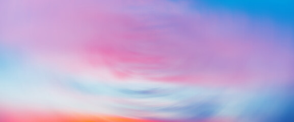 Wall Mural - Beautiful backdrop of sunset sky with pink orange light clouds in blue sky. Colorful smooth dawn sky gradient. Nature background of sunrise. Amazing morning heaven. Slightly cloudy evening atmosphere.