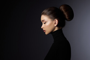 fashion art studio portrait of beautiful elegant woman in black turtleneck. hair high beam, perfect 
