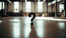 A Black Question Mark Standing In The Middle Of An Empty Warehouse Or Gym With A Sepia Look, Beautiful Blurry Hidden Light Indoor Background. AI Generative.