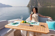 © Andrea - young amazing woman drink in relax on the yacht