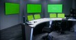© Framestock - Workspace in security control center for monitoring CCTV cameras. Computer monitors on the table and big digital screens on the wall with chroma key showing surveillance cameras footage. Green screen.