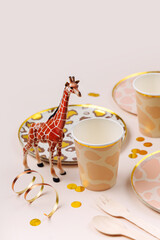 Wall Mural - Safari animals birthday party decorations and props. Cute paper party plates and cups for themed kids party. Set of holiday disposable tableware for party or picnic.