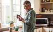 © Tinashe Njaku/peopleimages.com - CBD oil, tea and a senior man in the kitchen of a retirement home for his morning medication routine. Thinking, medical cannabis and dose with a mature man holding a medicine bottle in his house