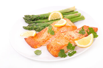 grilled salmon with asparagus and lemon- plate isolated on white background