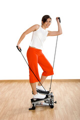 Wall Mural - Beautiful young woman making exercise on the gym