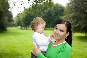 Wall Mural - happy family on green meadow