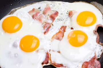 Wall Mural - detail of ham and eggs in a pan