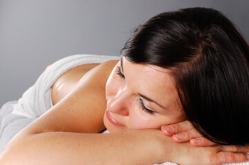 Sticker - attractive brunette woman relaxing in spa salon