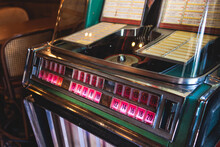 Vintage American Music Jukebox With Illuminated Buttons, Process Of Choosing Song Composition, Retro Old-fashioned Juke-box With Vinyl Discs Musical Box Machine In Cafe Diner Restaurant