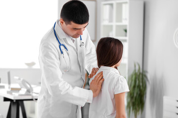 Poster - Doctor checking posture of little girl in clinic