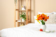 © Pixel-Shot - Vase with beautiful tulip flowers on bed, closeup