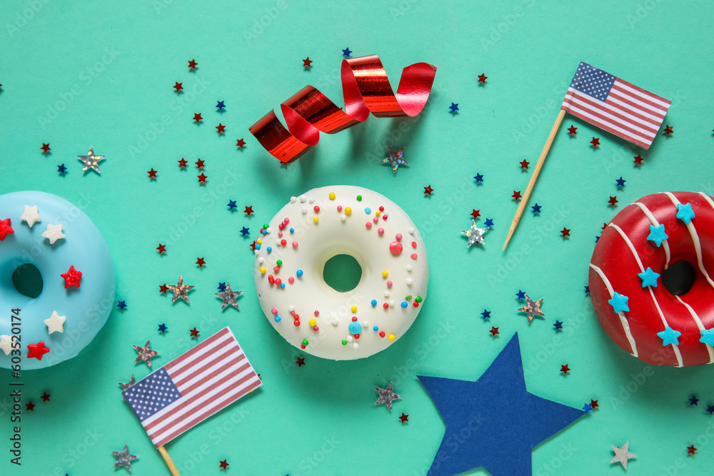 Composition with donuts, USA flags and confetti on turquoise background. Independence Day celebration