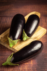 Fresh eggplants on the table.