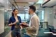 © Drazen - Young colleagues talk during coffee break in office.