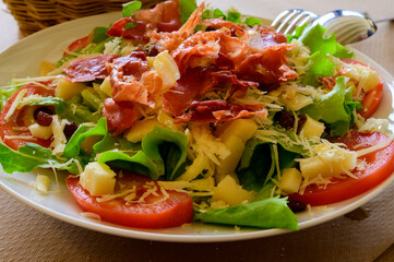 Wall Mural - Healthy food, fresh summer mixed salad with green lettuce salad leaves, cucumbers, tomatoes, cheese and bacon