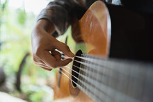 Happy Young Woman Hands Playing Acoustic Guitar Musician  alone Compose Instrumental Song lesson On Playing The Guitar