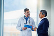 © Koegelenberg/peopleimages.com - Consultation, medical and doctor talking to patient and writing notes on a clipboard for diagnosis in a clinic. Medicine, healthcare and professional man consulting person with health insurance