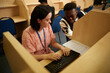 © Connect Images - University students using computer in library