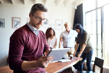 Aufkleber - Man, tablet and working in office meeting with team in creative workspace and planning, research and management. Businessman, happy teamwork and web design leader with technology for project
