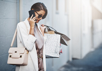 Wall Mural - Phone call, shopping bag and woman in city for communication, discount or promotion of fashion. News, gift offer and customer or person with clothes sale, wealth and ecommerce or product review chat