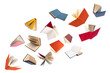 Colorful hardcover books flying on white background.
